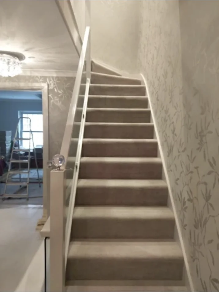 Wallpapered staircase in a residential property